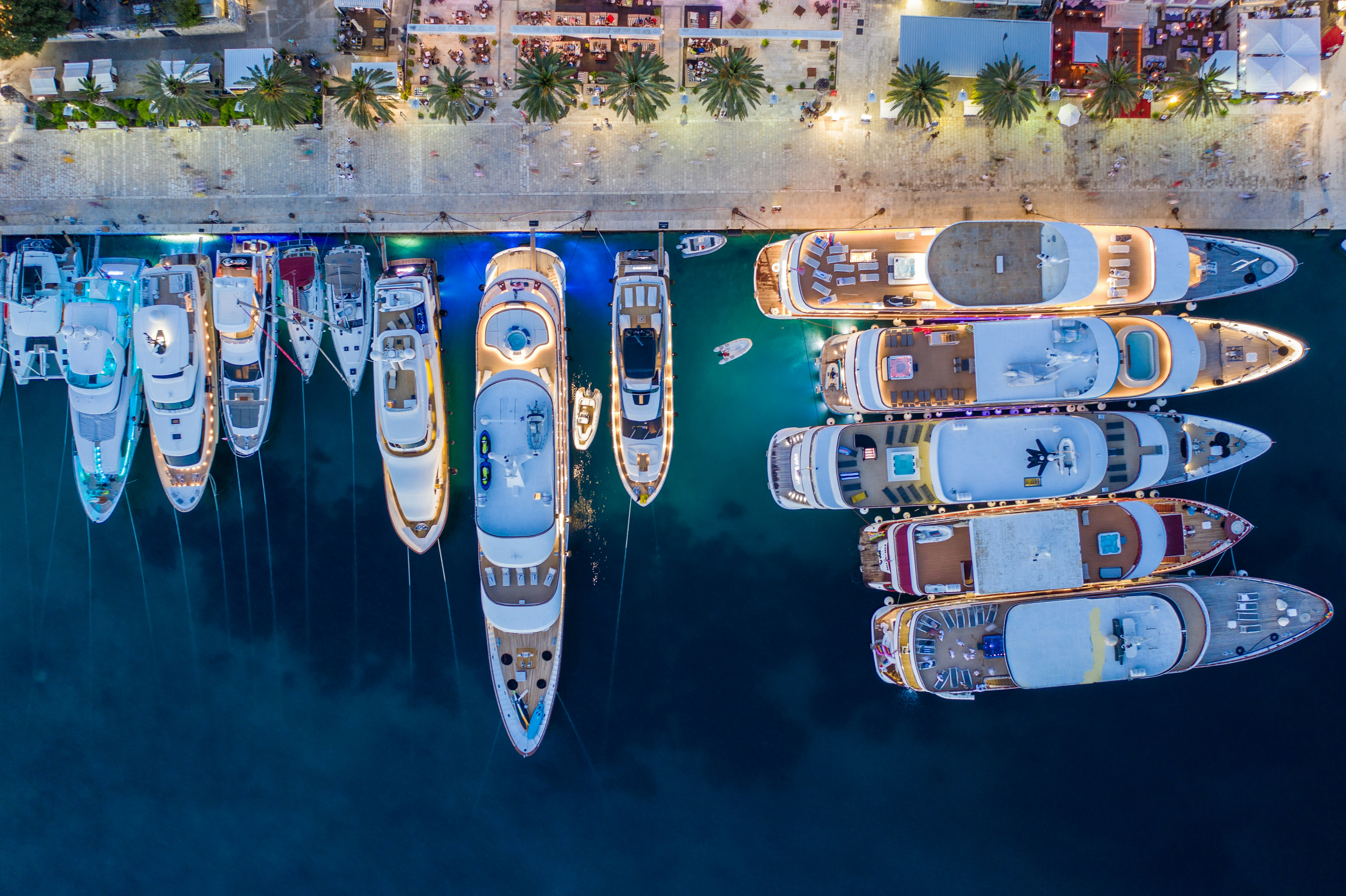 blue and white boat on water during daytime